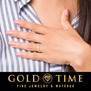 Woman wearing the slim 3mm yellow gold comfort fit wedding band