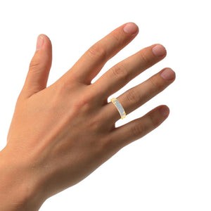 Woman's hand wearing the 10K gold diamond wedding band on its own