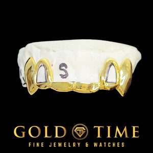 Gold grill with solid tips, open face, and fangs on a background with Gold Time branding.