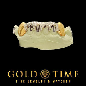 Two-tone bottom grill with yellow solid canines and white drip across the front teeth
