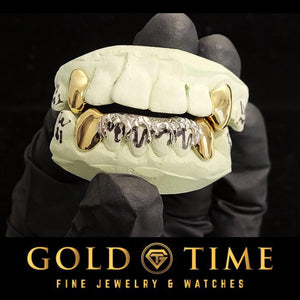 Front view of two-tone 8 piece grillz with yellow solid canines and white trillion drip on a mold