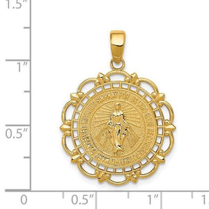 14k gold Miraculous Medal pendant shown next to a ruler for size reference