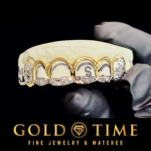 Two tone six tooth open face grillz with yellow frames, white trillion tips and diamond cut canines on a dental model