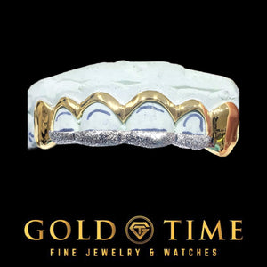 Yellow gold 6 piece grill with solid canines and open window front teeth with white diamond dust tips on a mold