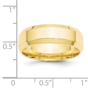 Yellow gold beveled edge wedding band beside a ruler showing the 7mm width