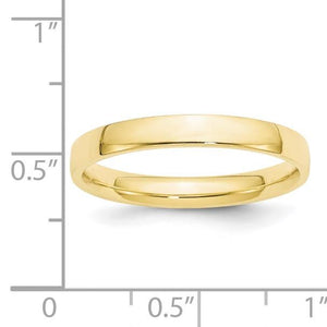 3mm yellow gold wedding band against a half inch scale for size reference