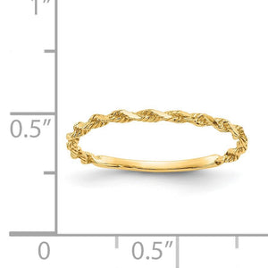 Yellow gold twisted rope ring next to a ruler showing a slim, dainty band width