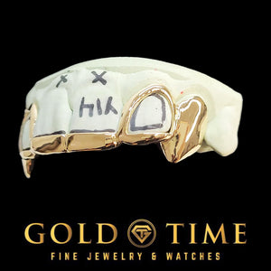 Gold fang grillz on a black background, featuring the Gold Time logo.