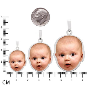 Baby photo pendants in three sizes next to a dime and ruler