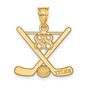 Yellow gold hockey pendant with crossed sticks, a net and the name Tyler