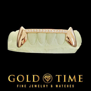 Custom 6 piece rose gold fang grillz with moissanite tip bar on a dental mold