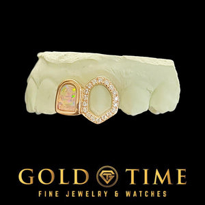 Rose gold double cap grillz with a synthetic opal cap and a moissanite open face fang on a dental mold, Gold Time