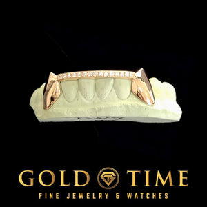 Rose gold fang grillz with moissanite tip bar, angled view