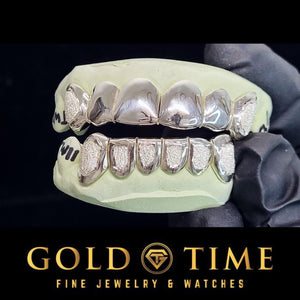 Silver 12 piece diamond dust grillz with perm cuts on top and bottom molds