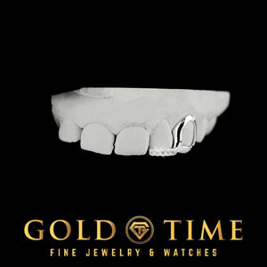 White gold open face canine grill with moissanite tip on a top dental mold
