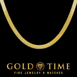 Close-up of a 5mm 14k yellow gold flat herringbone chain on black