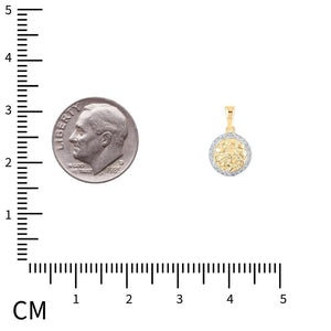 Circle nugget diamond pendant beside a dime and a centimeter ruler for size