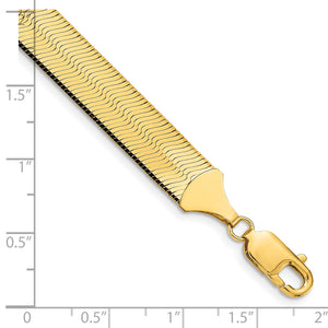 10mm gold herringbone chain and lobster clasp on a ruler