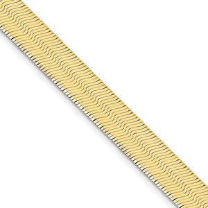 Close view of the flat silky links of a 14K gold herringbone chain