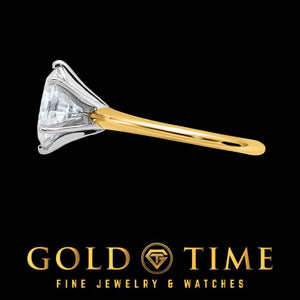 Side profile of the oval moissanite solitaire on a slim yellow gold band