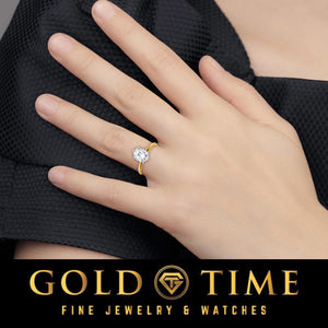 Hand wearing the oval moissanite solitaire engagement ring