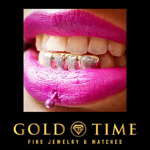Close-up of a smile wearing two-tone diamond dust box grillz on the bottom teeth with bright pink lipstick