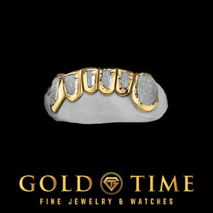Bottom grill on a mold with yellow gold box frames around white diamond dust faces