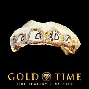 Two-tone 6 piece open face diamond dust grillz with rose accents on a dental mold