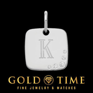 Silver tone cushion shaped initial charm engraved with the letter K and a cluster of flush set natural diamonds in one corner