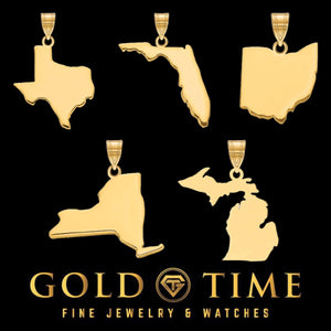 Five solid gold state outline pendants including Texas, Florida, New York and Michigan on a black background