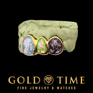 Galaxy enamel grillz caps in mixed blue, green and purple swirls set in gold frames