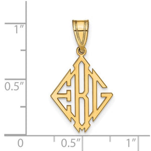 Yellow gold monogram pendant measured against a ruler, roughly three quarters of an inch tall