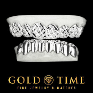 Custom 16 piece silver grillz set on dental molds, top 8 with full trillion diamond cuts and bottom 8 solid with diamond dust tips, Gold Time