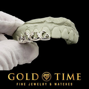 4 piece 3D wave grillz held on a dental mold