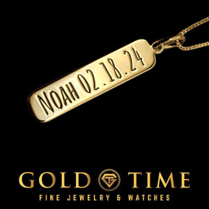 Gold vertical bar pendant engraved with NOAH 02.18.24 on a box chain, black background with the Gold Time logo