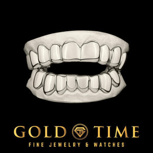 White gold or silver solid grillz set, top and bottom, on dental molds