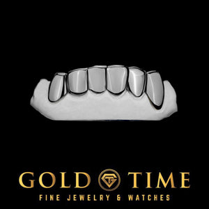 White gold or silver 6 piece solid perm cut grillz on a dental mold
