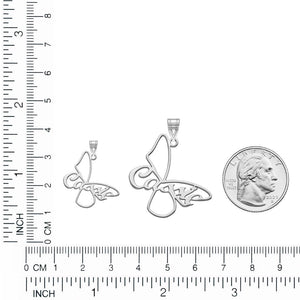 Butterfly name pendants in small and large sizes measured against a ruler next to a quarter