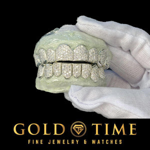 Fully iced 16 piece bustdown moissanite grillz set on top and bottom dental models with the Gold Time logo
