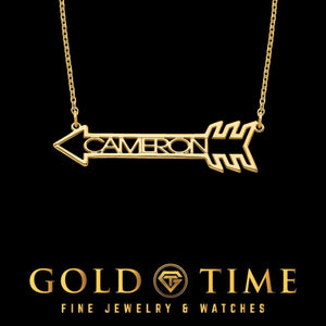 Gold custom arrow name necklace reading CAMERON on a fine cable chain, black background with the Gold Time logo