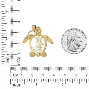 Gold sea turtle name pendant beside a quarter and a ruler, about 1.25 inches long