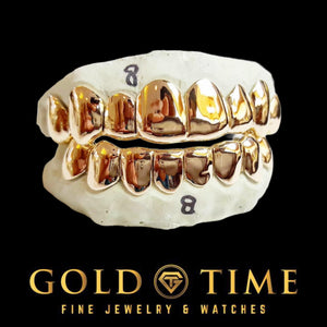 Yellow gold 8 piece top and bottom perm cut grillz on labeled dental molds