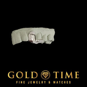 Side view of the white gold state cut-out fang and moissanite tip double cap grillz on a dental mold