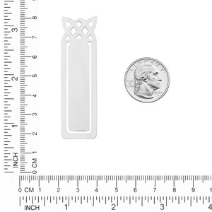 Celtic knot bookmark on a ruler next to a quarter, about 3 inches long