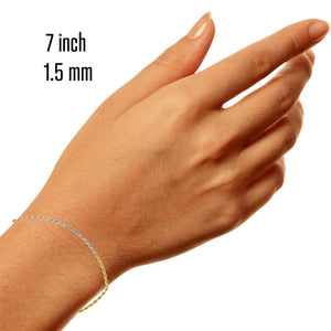 Woman's wrist wearing a 7 inch 1.5mm tri-color gold rope bracelet