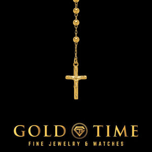 Close-up of the gold plated crucifix and beads at the end of the rosary necklace