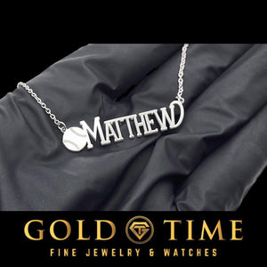 Sterling silver baseball nameplate necklace resting across a gloved palm