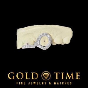 Two-tone double cap grill with an iced open face canine and a stone set incisor tip on a mold