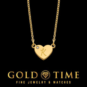 Yellow gold heart pendant engraved with a cursive K and set with a small diamond
