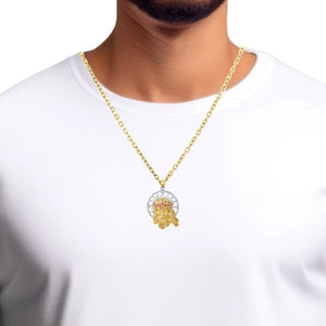 Man wearing a tri-color gold Jesus pendant on a gold chain